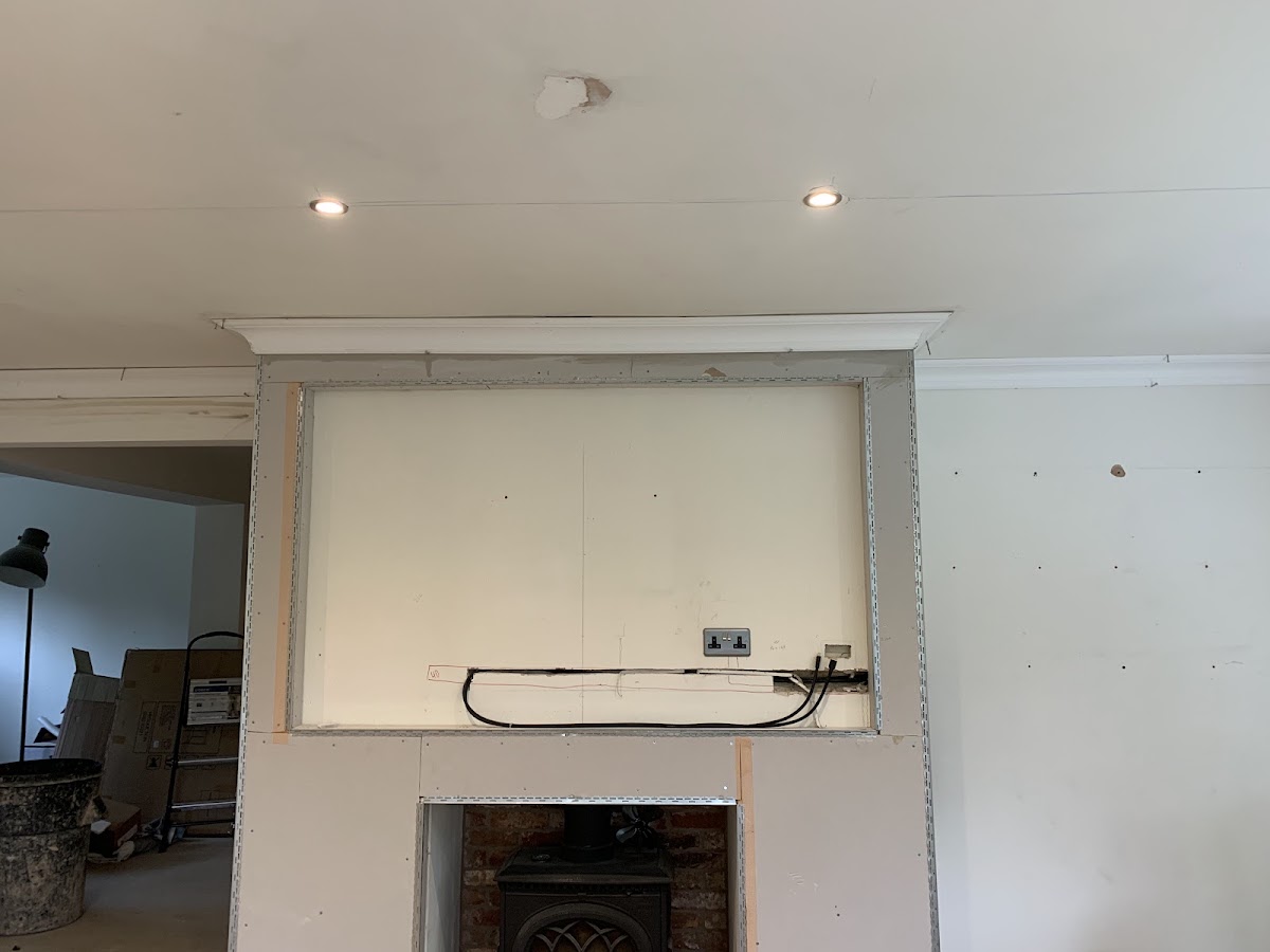 Feature wall with inset log burner